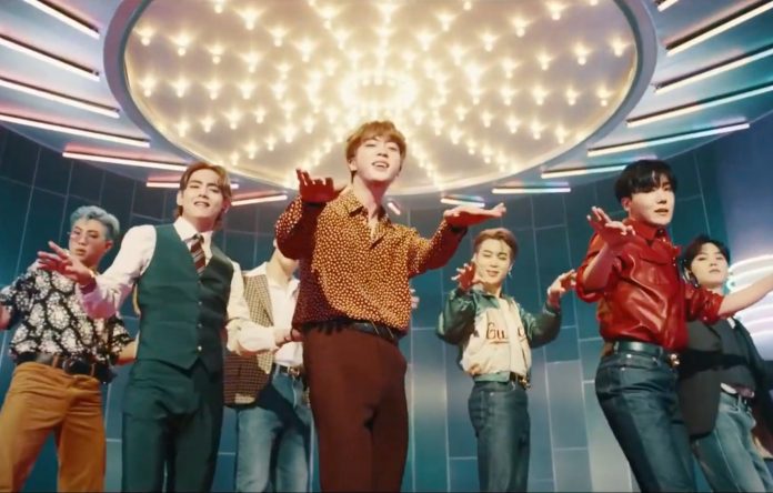 Global pop group BTS performing Arirang World Tour live on stage in dynamic colorful outfits representing high-demand international concert tours and premium world-class artists
